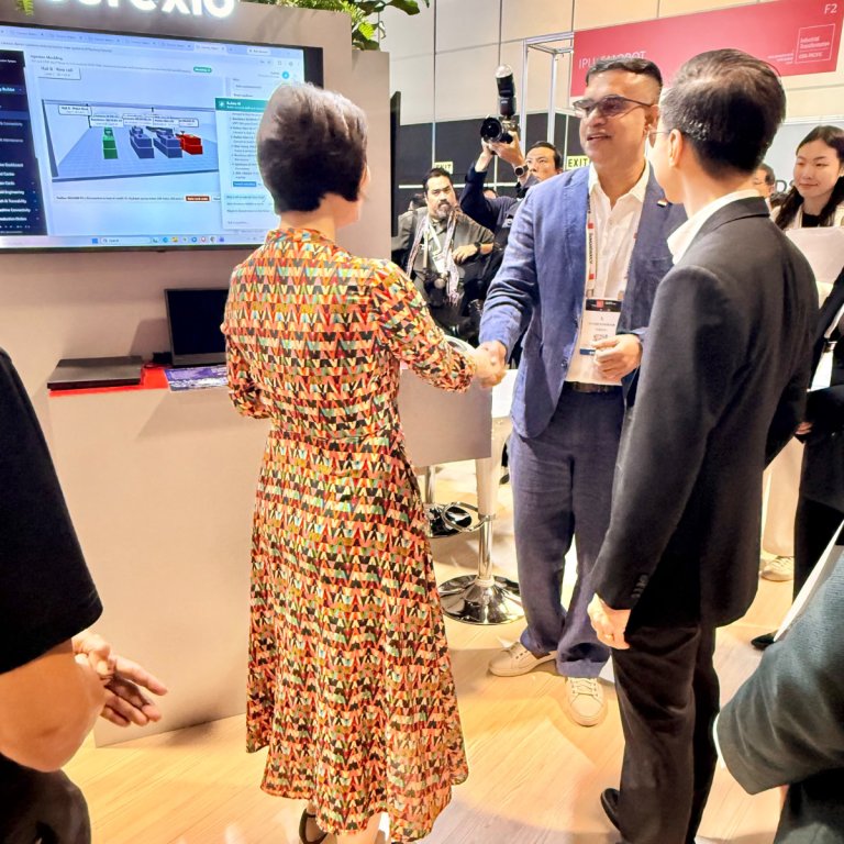 Minister Gan Siow Huang congratulating Cerexio CEO Mr. Gowrishankar